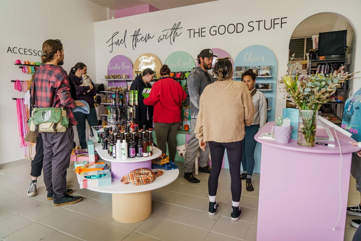 People gathering around the shop counter.
