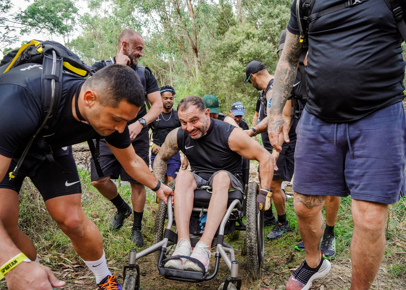 Teammates helping a racer through the course.