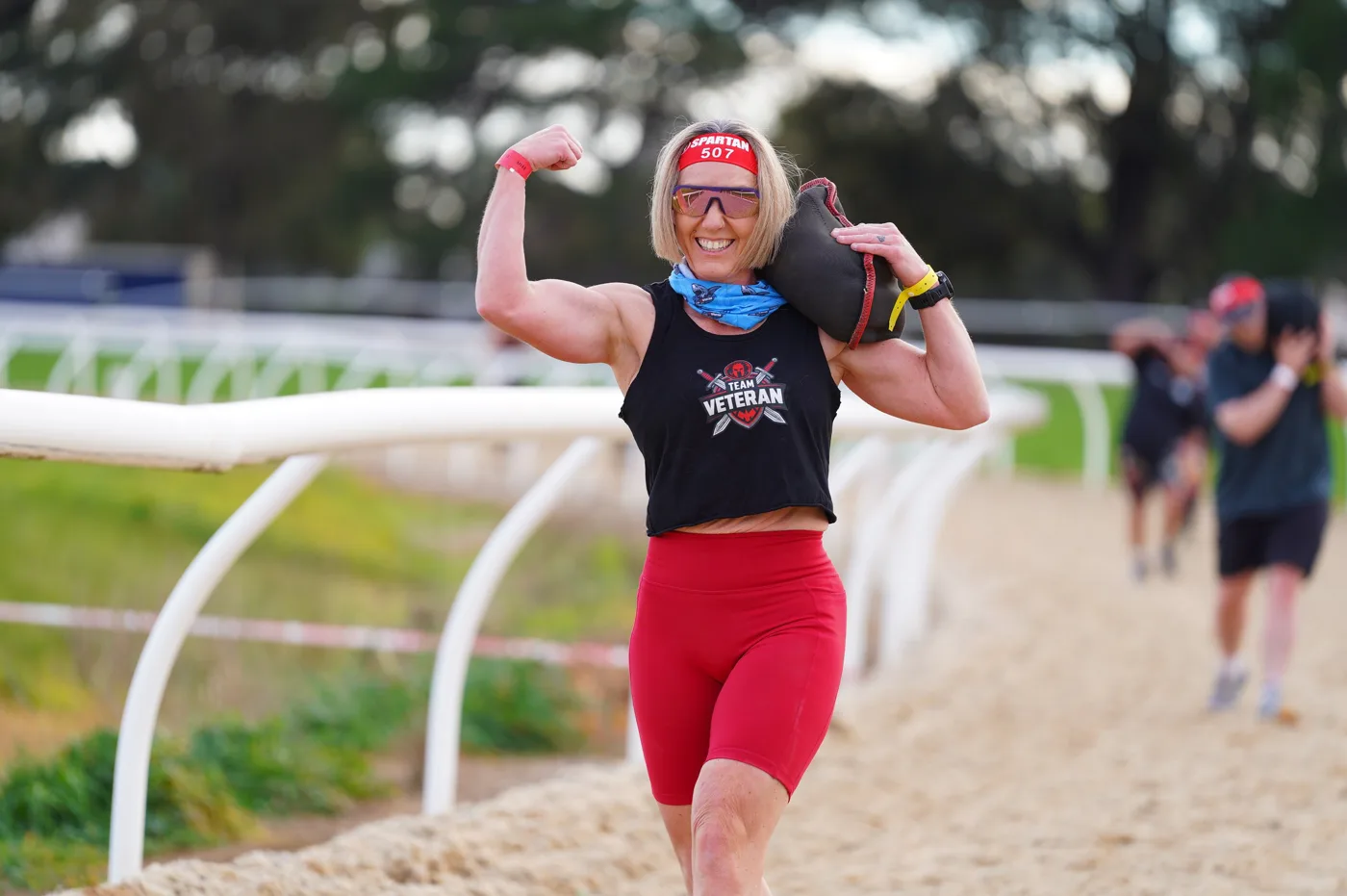 Flexing on the sandbag carry.